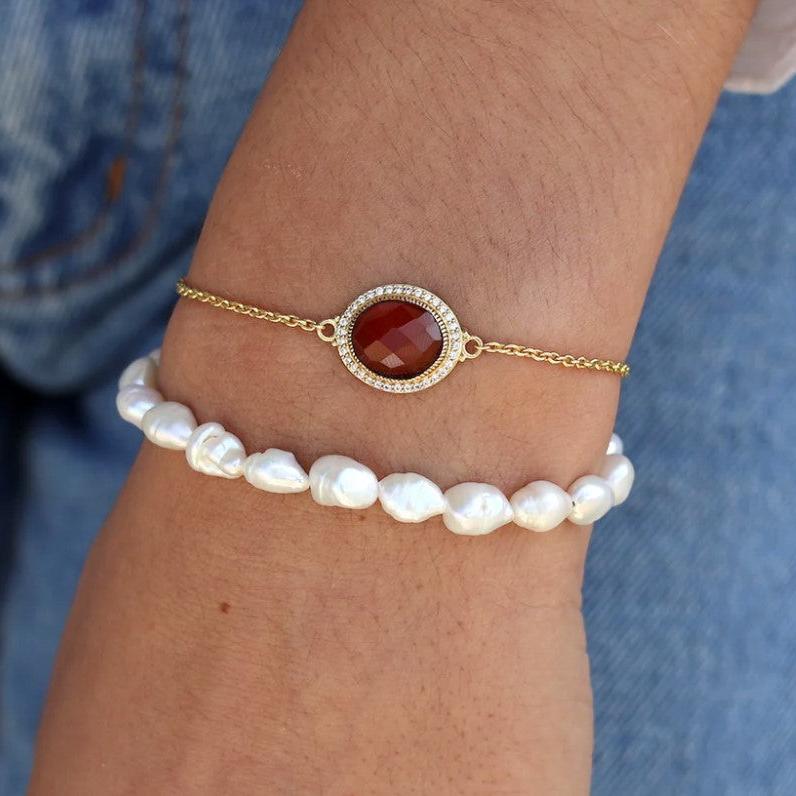 Bracelet doré pierre ovale facettée et zircons (rød sten)