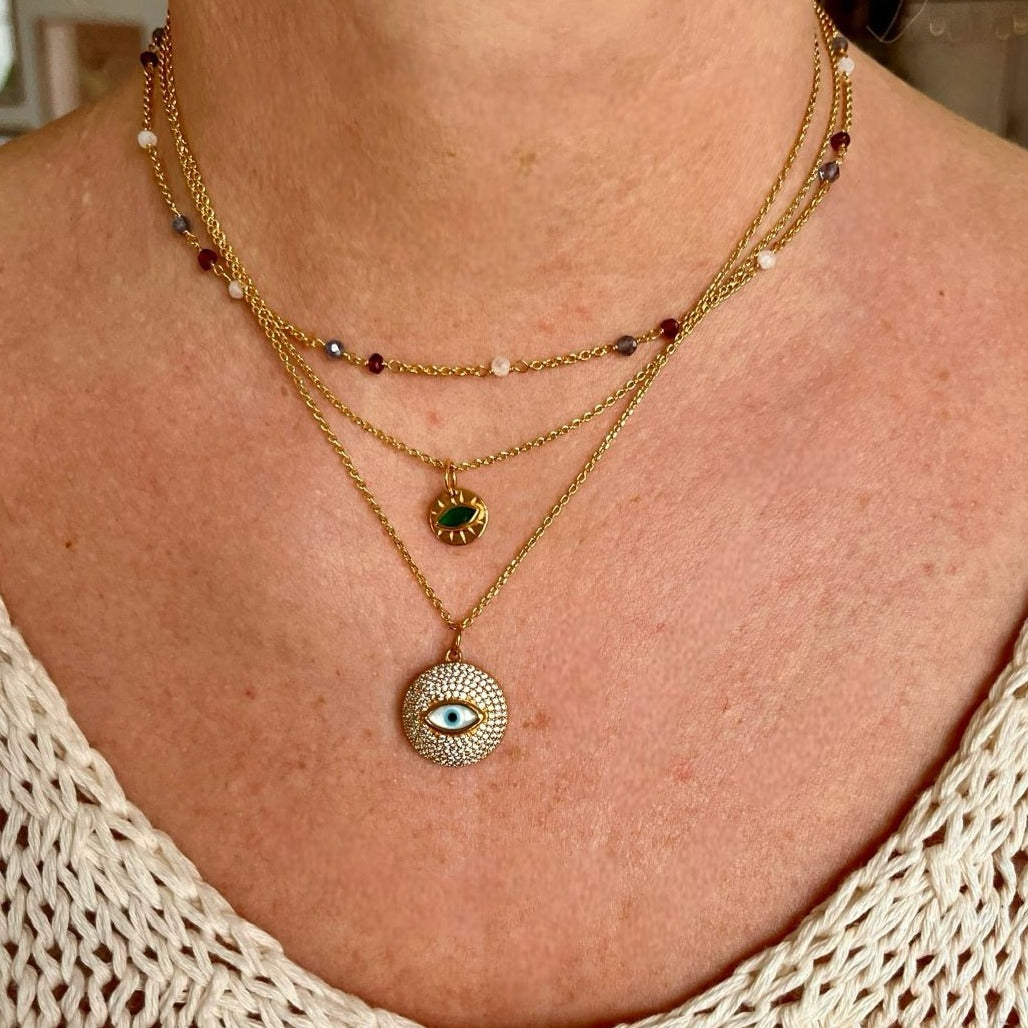 Collier doré médaille oeil en nacre et zircons